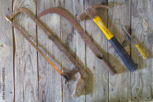 old many kinds of tools is placed on the wooden table