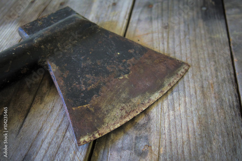 old ax on a wooden table