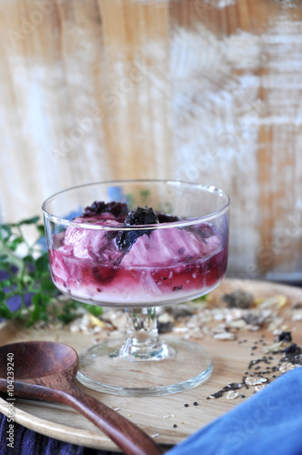 Glass of Blueberry Yogurt on Wooden Plate