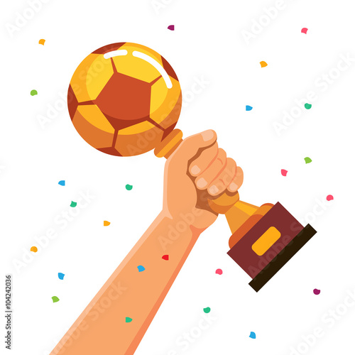 Winner team player holding soccer cup trophy