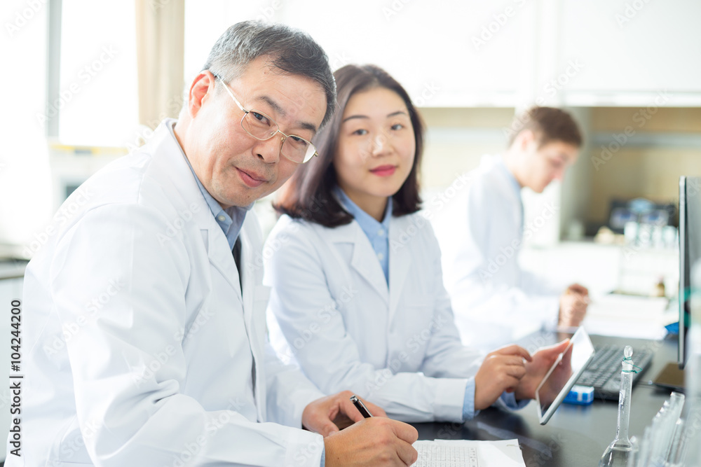 people doing chemical experiment in modern lab