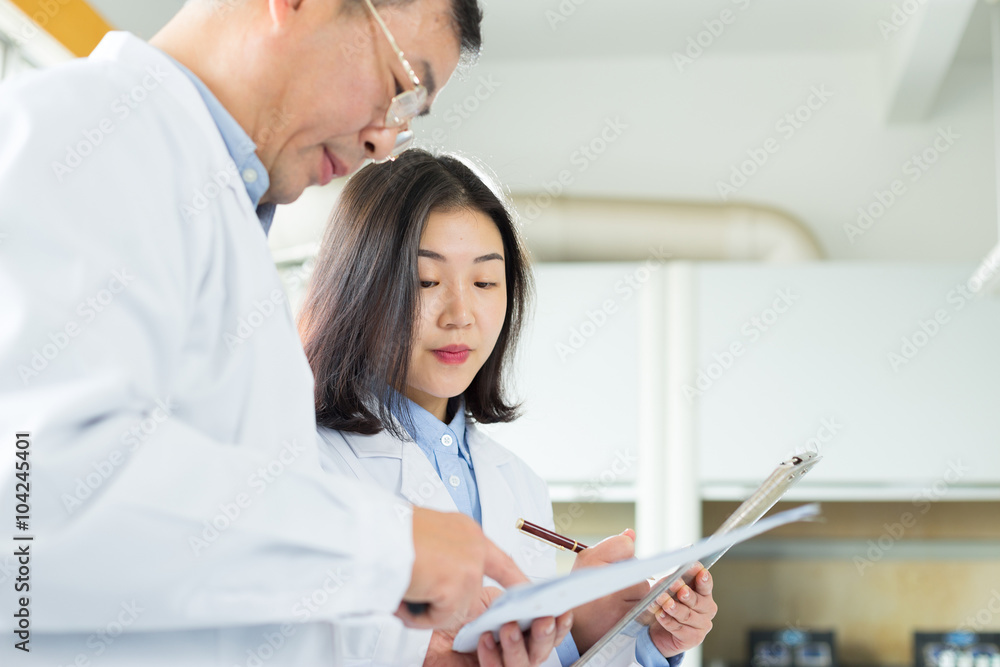 people doing chemical experiment in modern lab people doing chemical experiment in modern lab