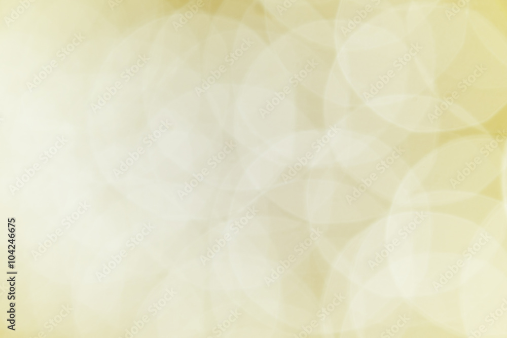 Gold ray bokeh glitter defocused lights abstract background.