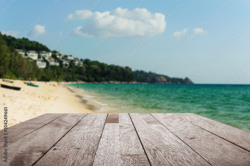 Fototapeta premium Wood floor top on blurred blue sea and white sand beach with som