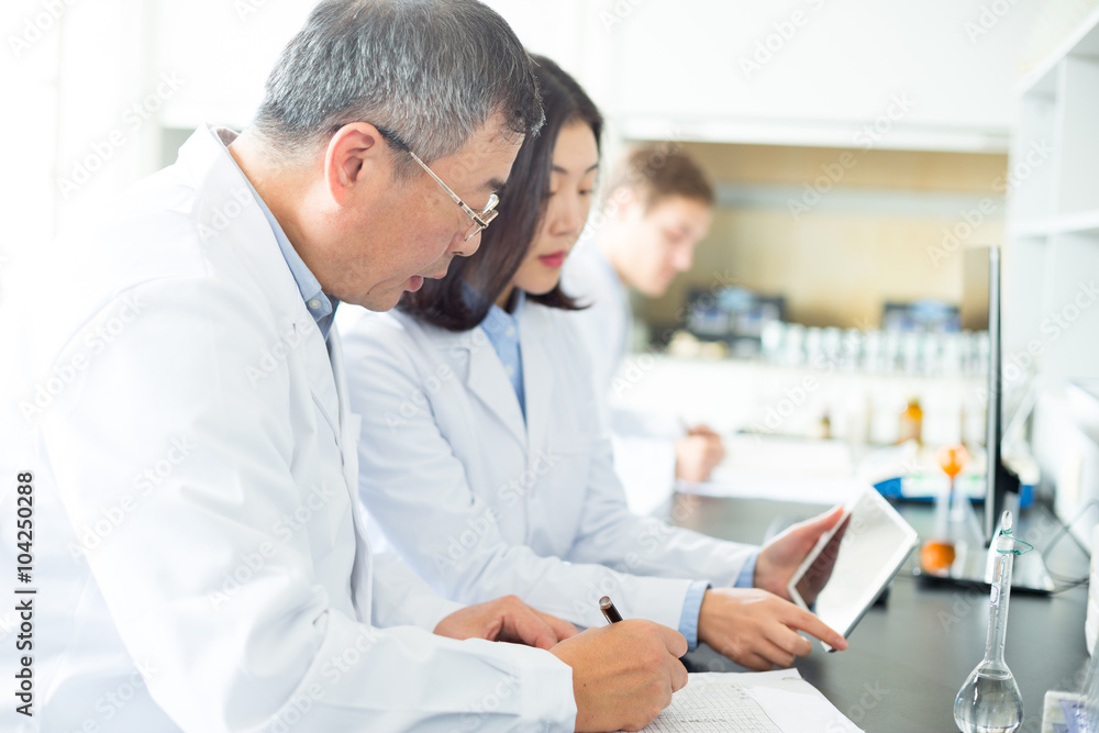 people doing chemical experiment in modern lab