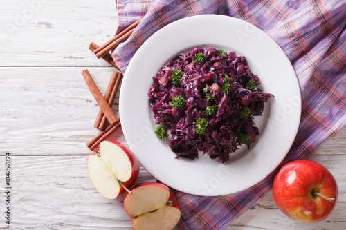 braised red cabbage with ingredients on the table. Horizontal top view  