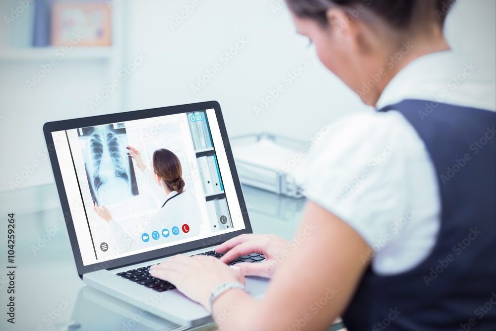 Composite image of female doctor studying xray Composite image of female doctor studying xray