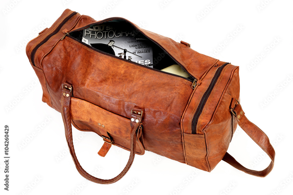 Fotografie brown leather travel bag isolated on white background available with clipping pa