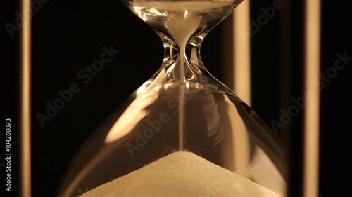 A trickle of sand in the hourglass runs out