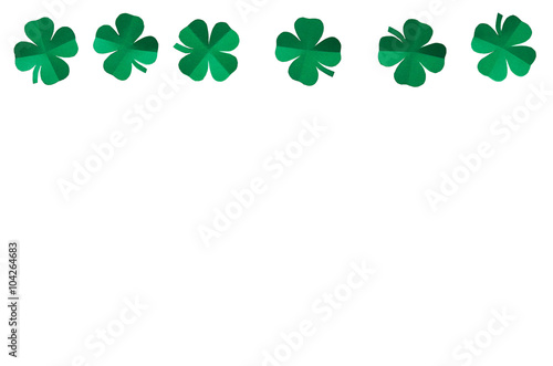 Emerald green paper clover shamrock leafs wreath border frame on white background isolated without shadow. St. Patrick's Day postcard template.
