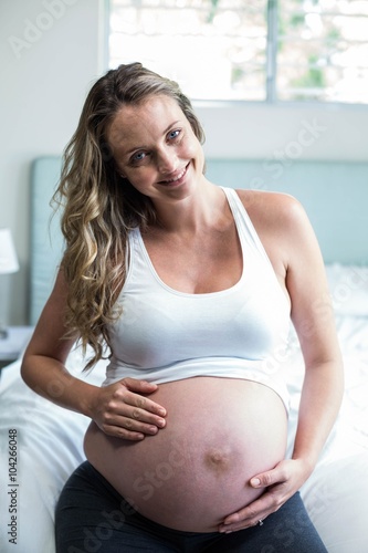 Free Download Pregnant woman massaging her belly - GFXLoad