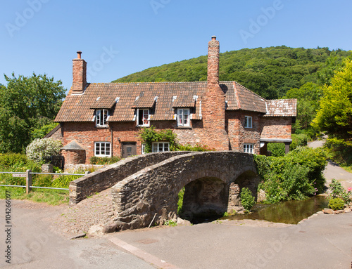 Allerford Somerset England UK packhorse bridge on a beautiful summer day  photo