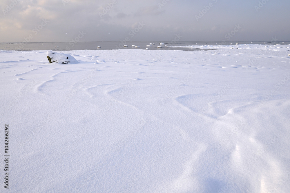 Snowy winter landscape by the ocean