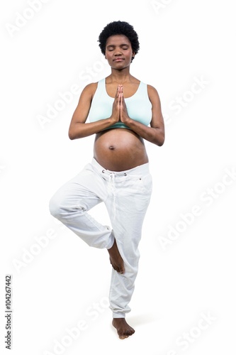 Pregnant woman doing yoga exercise