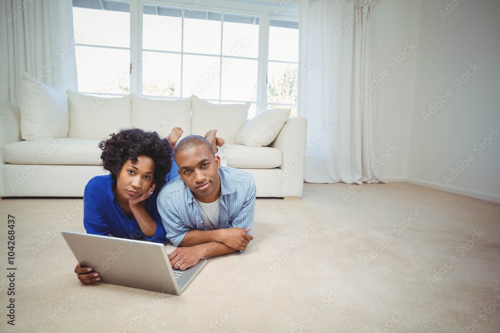 Happy couple lying on the floor Happy couple lying on the floor