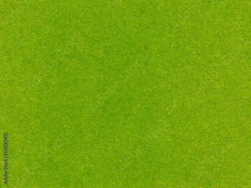 Green felt texture.