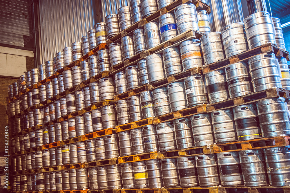 A lot of beer kegs at pallets at a brewery A lot of beer kegs at pallets at a brewery