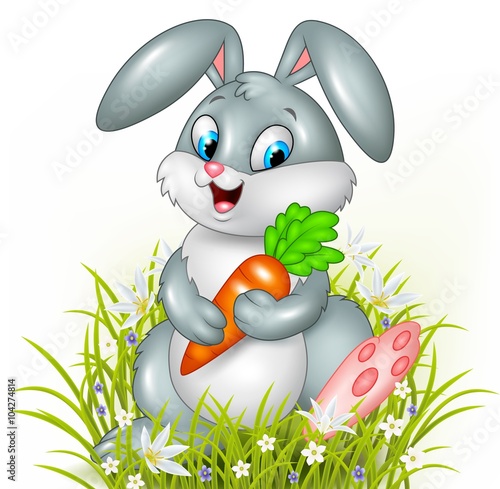 Cute bunny holding carrot