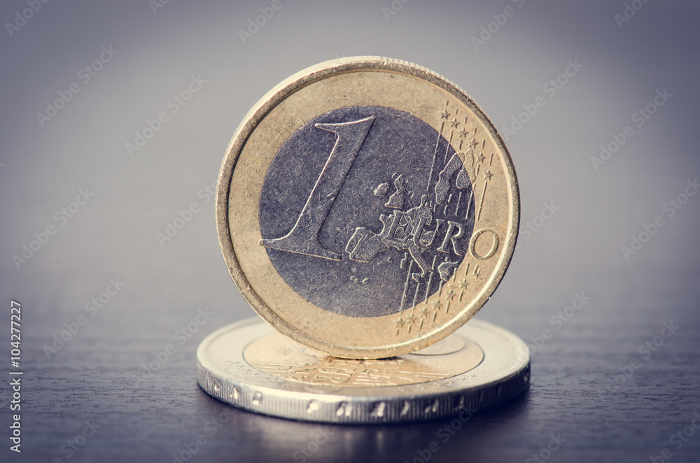 Euro money. Coins are isolated on a dark background. Currency of Europe. Balance of money. Building from coins. Euro money. Coins are isolated on a dark background. Currency of Europe. Balance of money. Building from coins.
