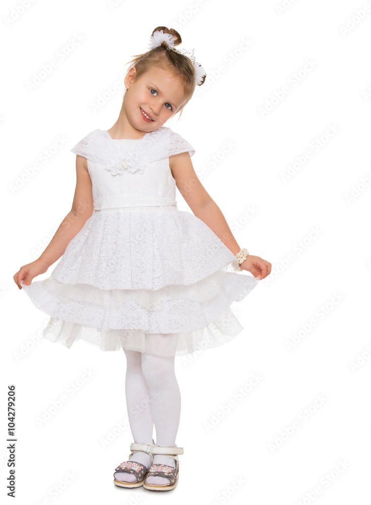 Cute little girl in fancy white dress gown holds his hands over the edge - Isolated on white background