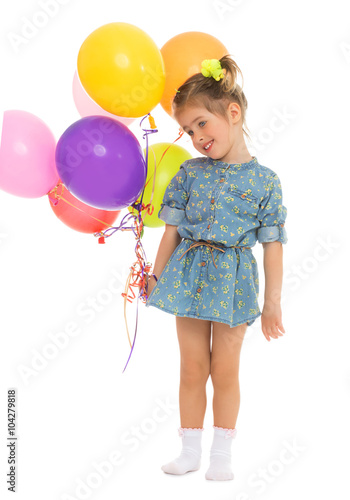 Lovely little girl in a short blue summer dress, with a bouquet of balloons - Isolated on white background