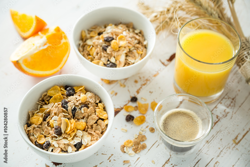Breakfast - muesli and fruits on white background Breakfast - muesli and fruits on white background