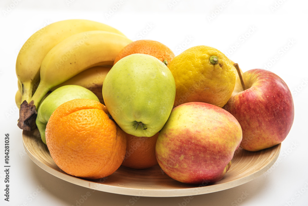 Tasty fruit orange, apples and banana on the wooden plate Tasty fruit orange, apples and banana on the wooden plate