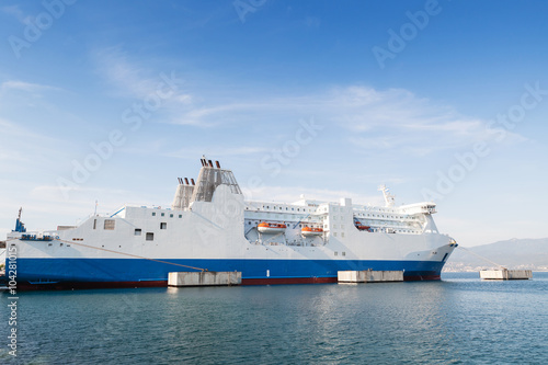 White ferry ship moored in port of Ajaccio