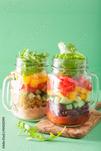 vegan quinoa bean vegetable salad in mason jars
