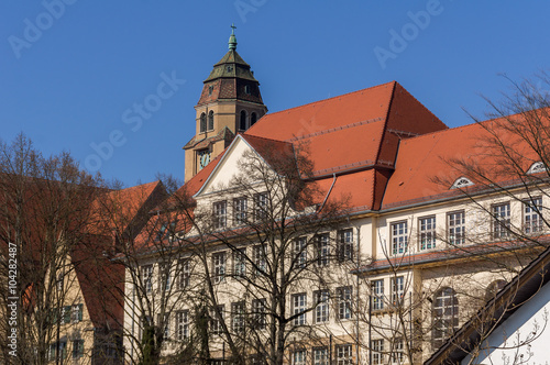 Altes Gebäude und Kirchturmspitze in Pforzheim, Brötzingen photo