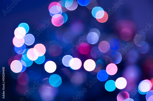 Festive bokeh background of a blurred city lights