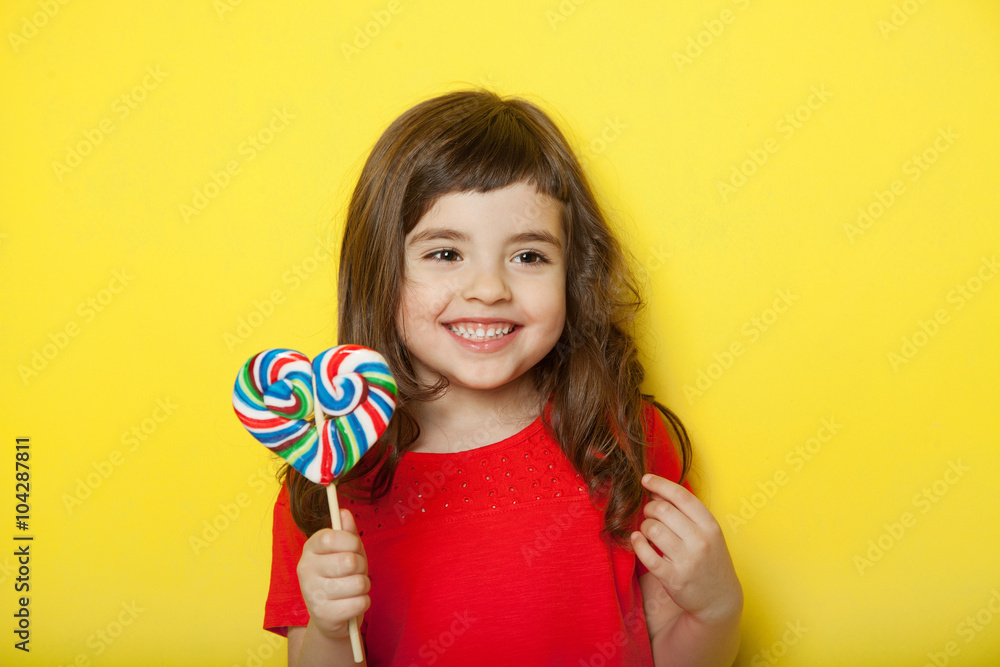 Sweet girl enjoying lollipop