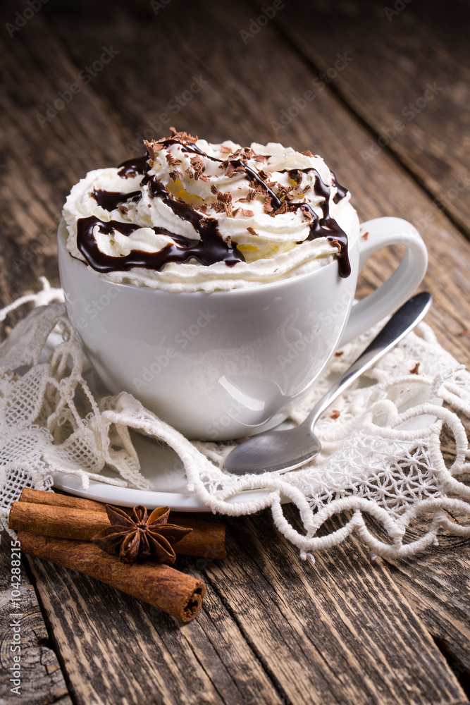 Cup of hot cappuccino with cinnamon for breakfast. Cup of hot cappuccino with cinnamon for breakfast.