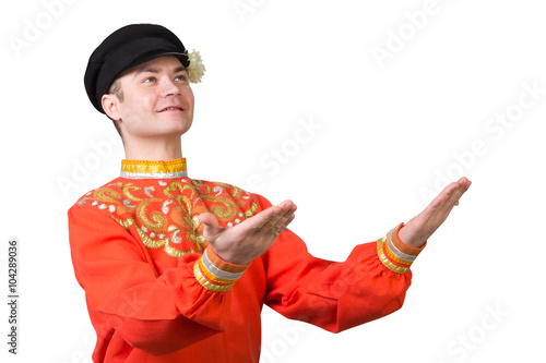 attractive russian guy dancing in folk costume