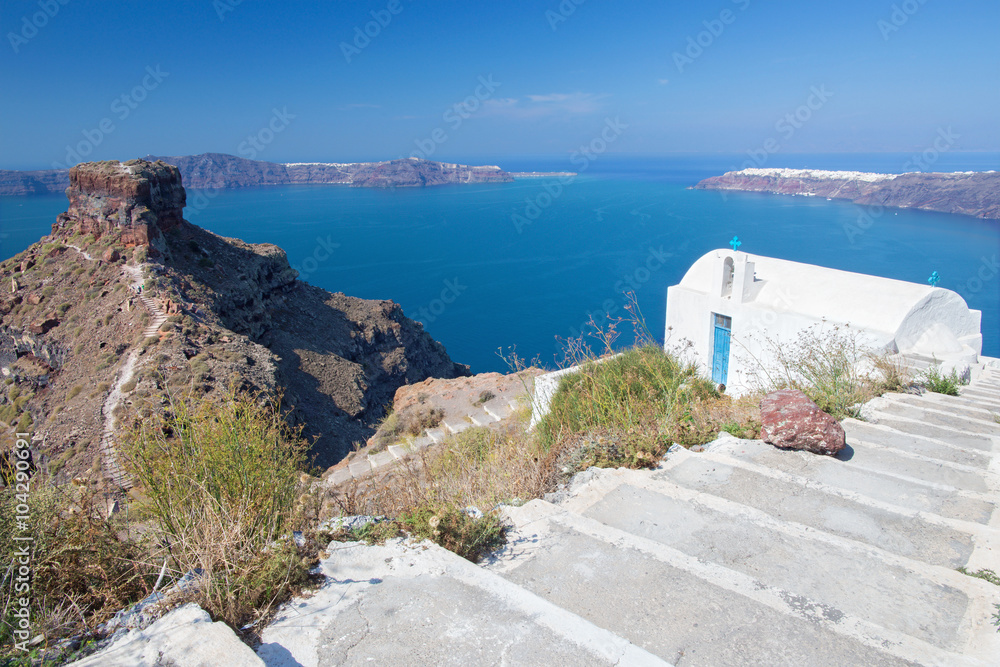 Santorini - The look to typically little church in Imerovigli and the Skaros castle.