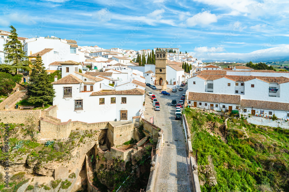 White spanish buildings built on the cliffs edge at Ronda. Andalusia. Spain