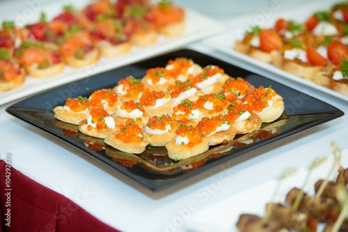 red caviar bites on the plate