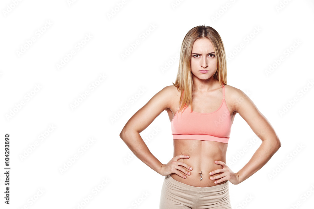 Beautiful young girl with a sports body, on a white studio backg Beautiful young girl with a sports body, on a white studio backg