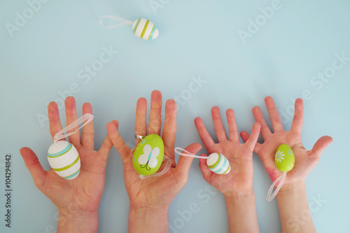Hands with colorful eggs 4