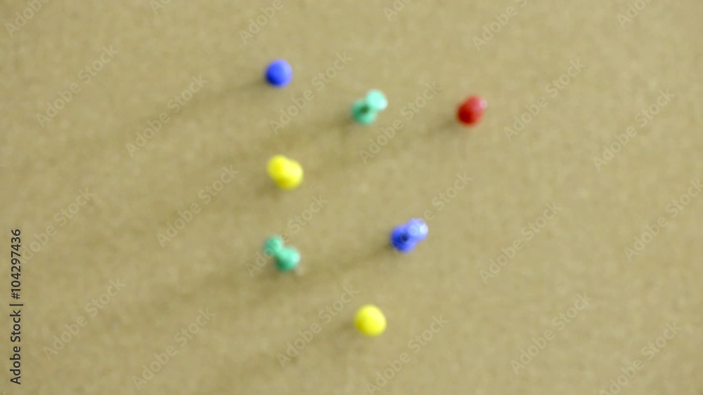 Close up of push pins on office noticeboard.. Slow sliding zoom motion. Concept of business message, information and communication. Close up of push pins on office noticeboard.. Slow sliding zoom motion. Concept of business message, information and communication.