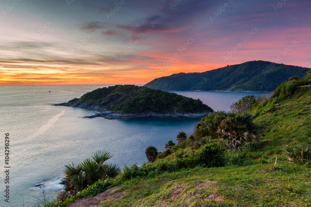 Beautiful sunset in promthep cape is a mountain of rock that extends into the sea in Phuket, Thailand