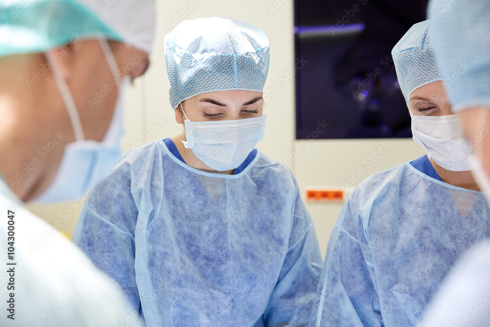 group of surgeons in operating room at hospital group of surgeons in operating room at hospital