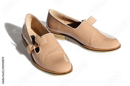 classic beige shoes from a patent leather with a small heel