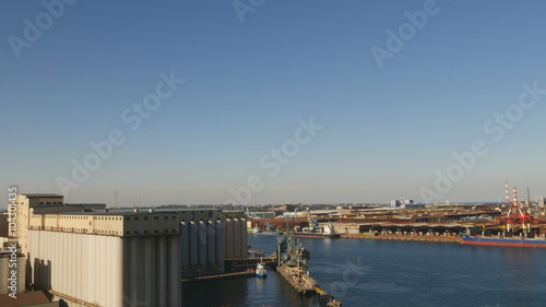 Aerial shot overlooking Kashima Port in blue skies. photo