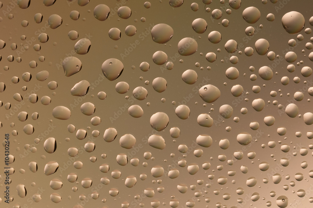 macro shot of liquid droplets with reflection. color background with water drops texture. gradient color macro shot of liquid droplets with reflection. color background with water drops texture. gradient color