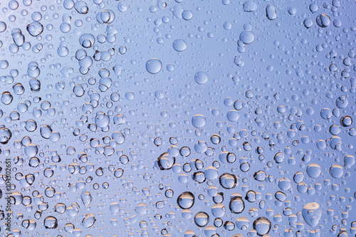 close-up of water drops on gradient color background. bubbles abstract background