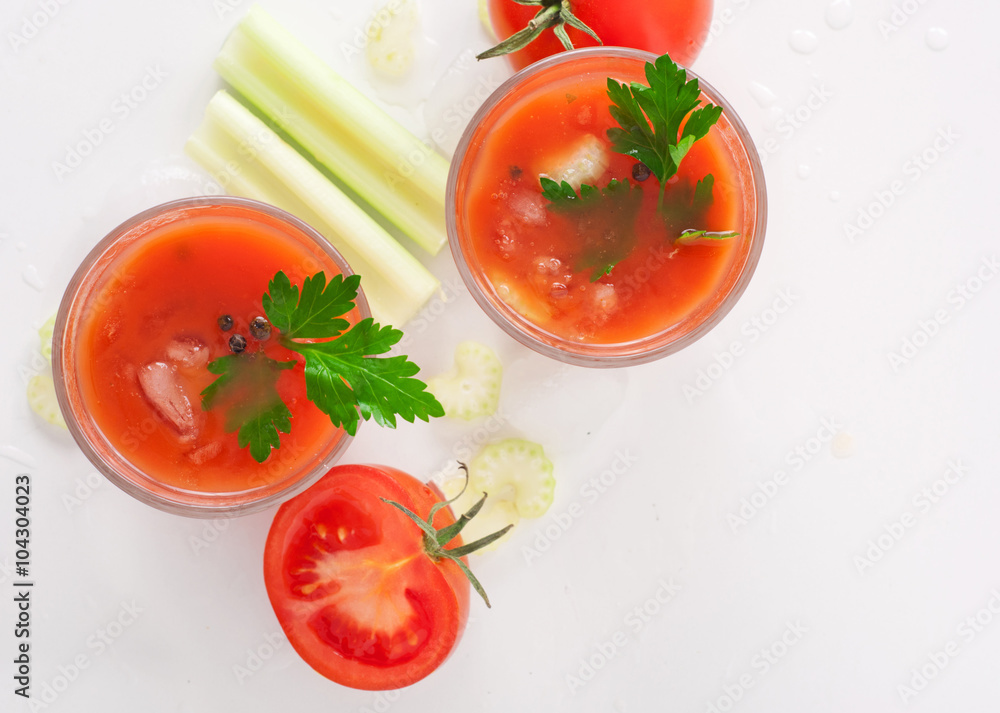 Tomato juice with celery on white background Tomato juice with celery on white background