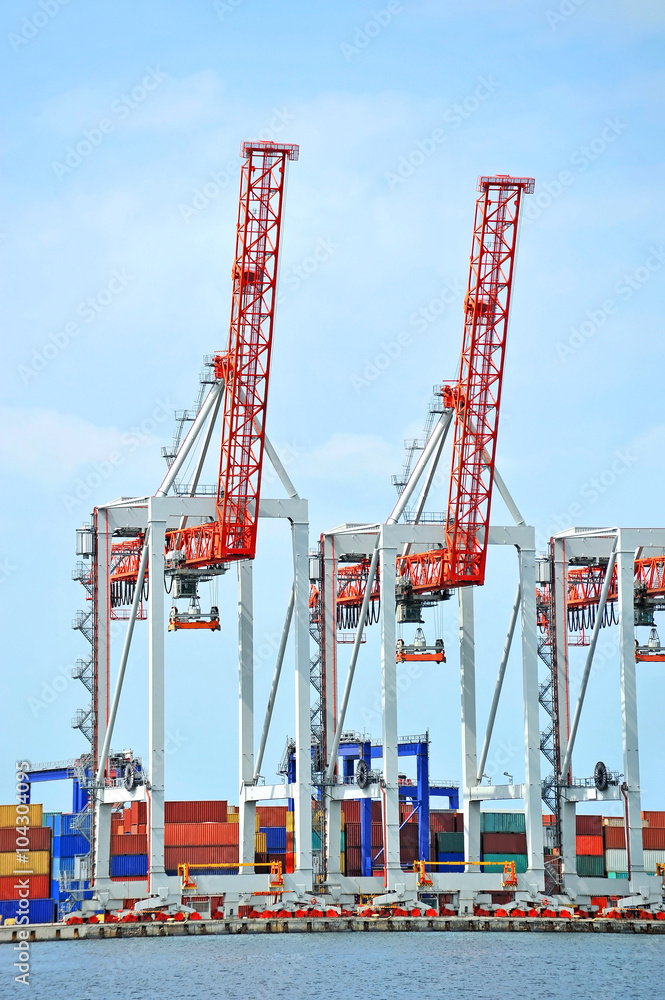 Fototapeta premium Port cargo crane and container