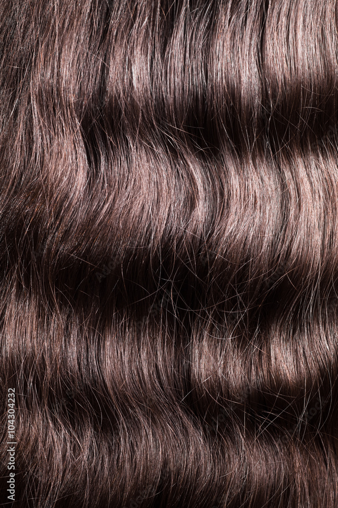 Naklejka premium Pure combed wavy hair brunette