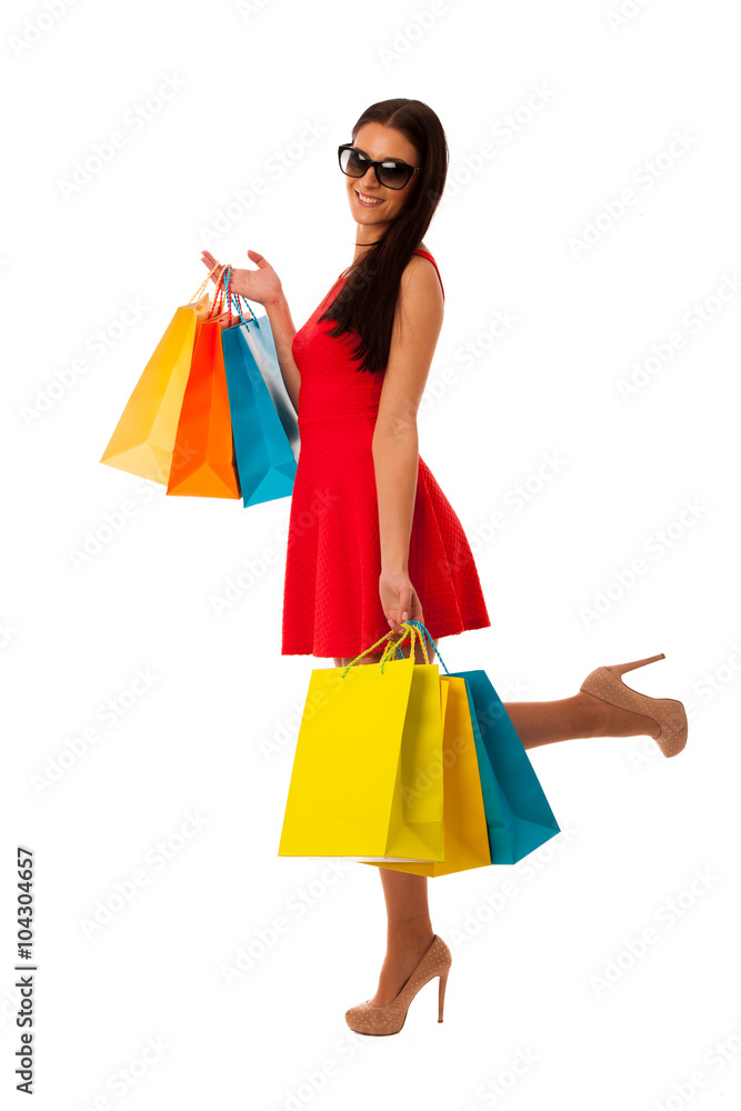 Woman in red dress with shopping bags excited of purchase in mal